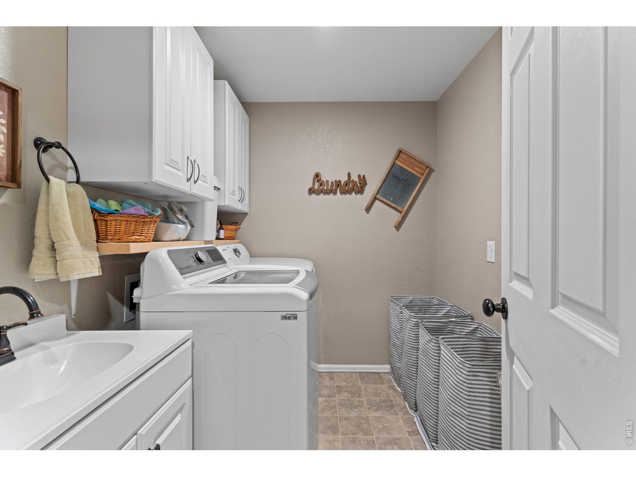 Spacious laundry room with a utility sink