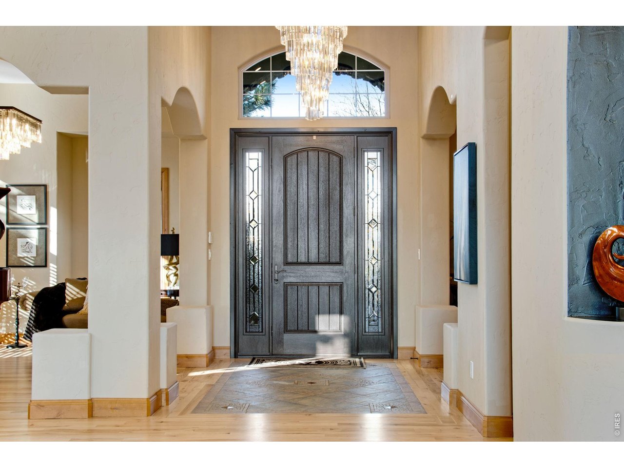 Grand and spacious foyer featuring tile inlay