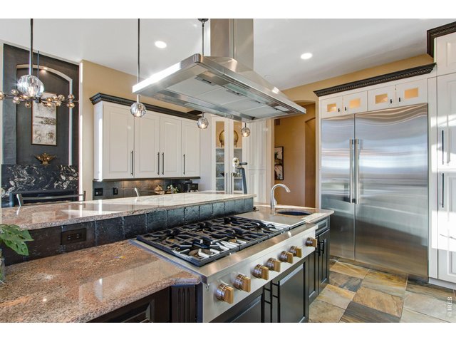 Property Photo 22 Gas range with flat grill and commercial hood
