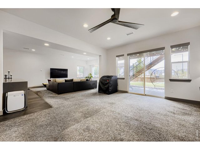 Property Photo 22 BASEMENT LIVING ROOM AND BONUS AREA