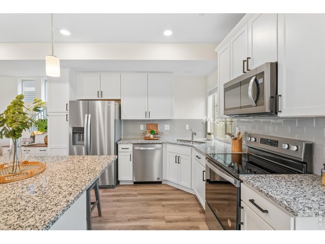 Property Photo 6 Granite countertops and stainless steel appliances, all included