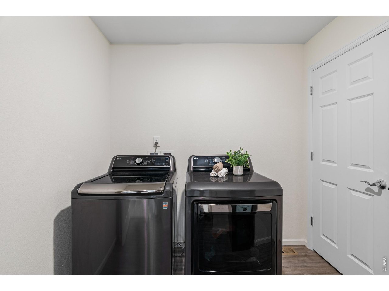 Laundry on upper level near both bedrooms with mechanical closet
