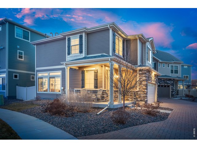 Property Photo 2 A delightful front porch with stylish siding and rock exterior