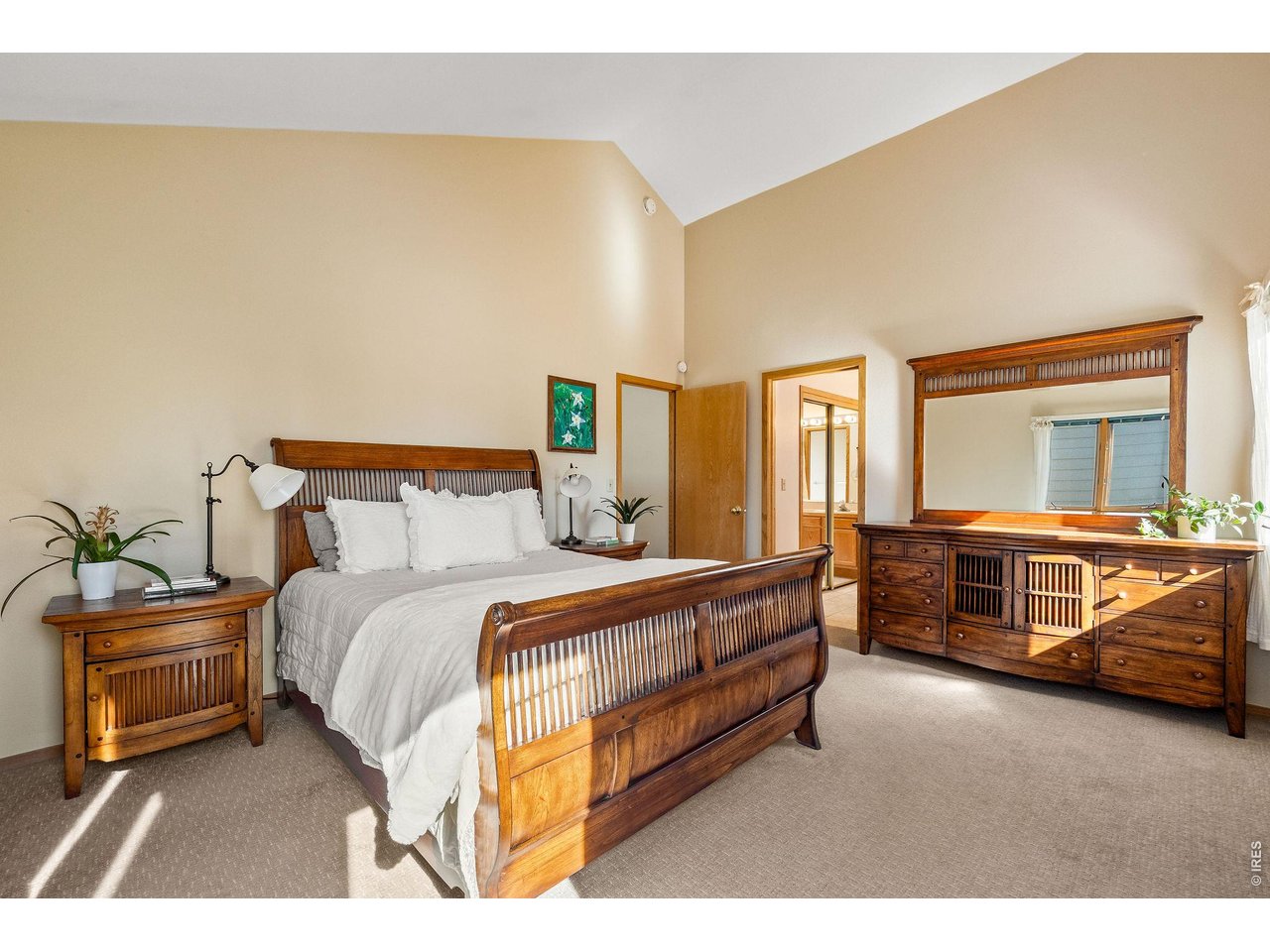 The sunlit, serene primary wing is complete with a king size bedroom, ensuite bathroom and oversized walk-in closet. 