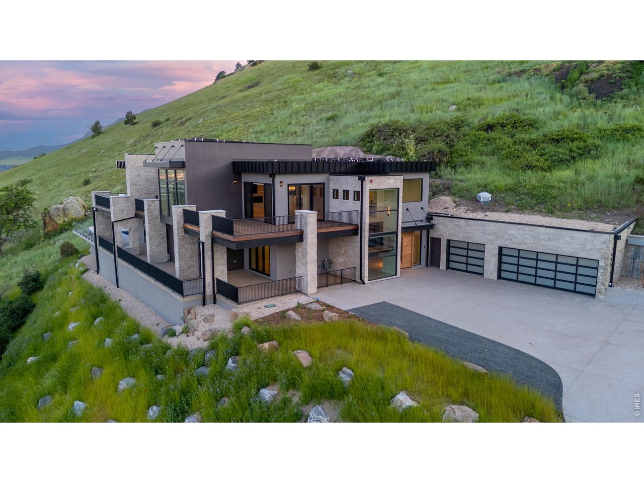 Perched above Boulder in the coveted Pine Brook Hills enclave, this private, resort-style retreat redefines elevated mountain living-where luxury, wellness, and breathtaking natural beauty converge just minutes from downtown. 