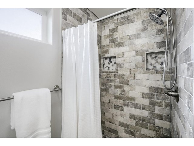 Property Photo 16 Primary custom tile shower