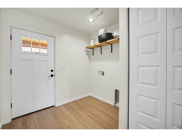 Property Photo 22 Laundry Room and Backdoor