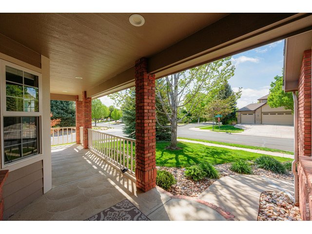 Property Photo 3 Inviting front porch - perfect for quite mornings and coffee!