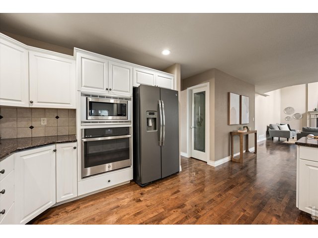 Property Photo 14 All appliances stay - gas stove, double oven, dishwasher, microwave and side-by-side refrigerator