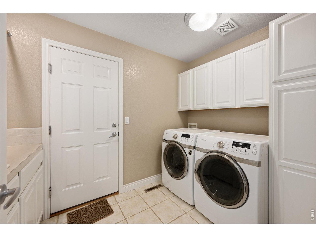 Nicely designed, expansive laundry room 