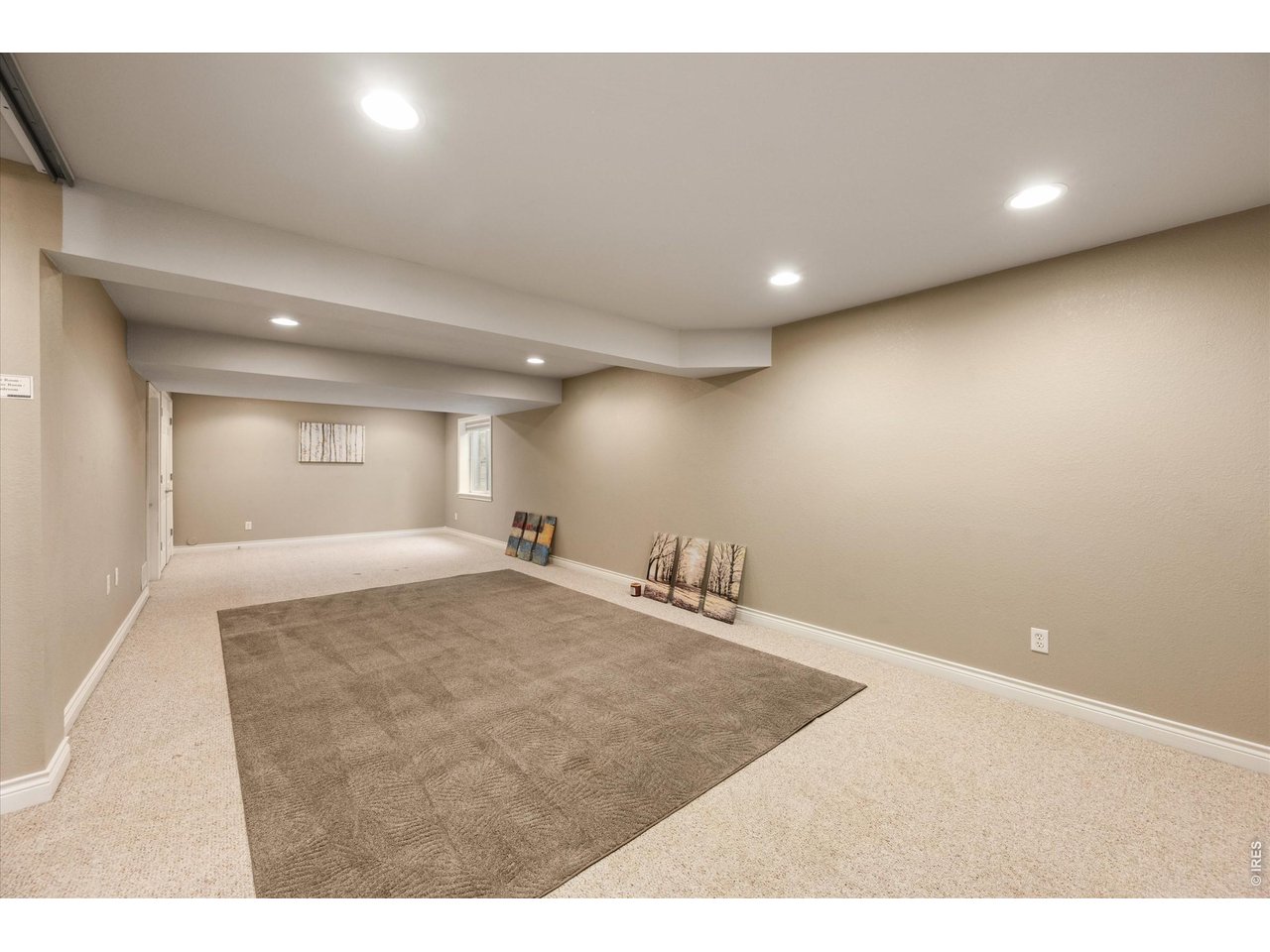 Expansive basement rec room with flexible living and entertaining space