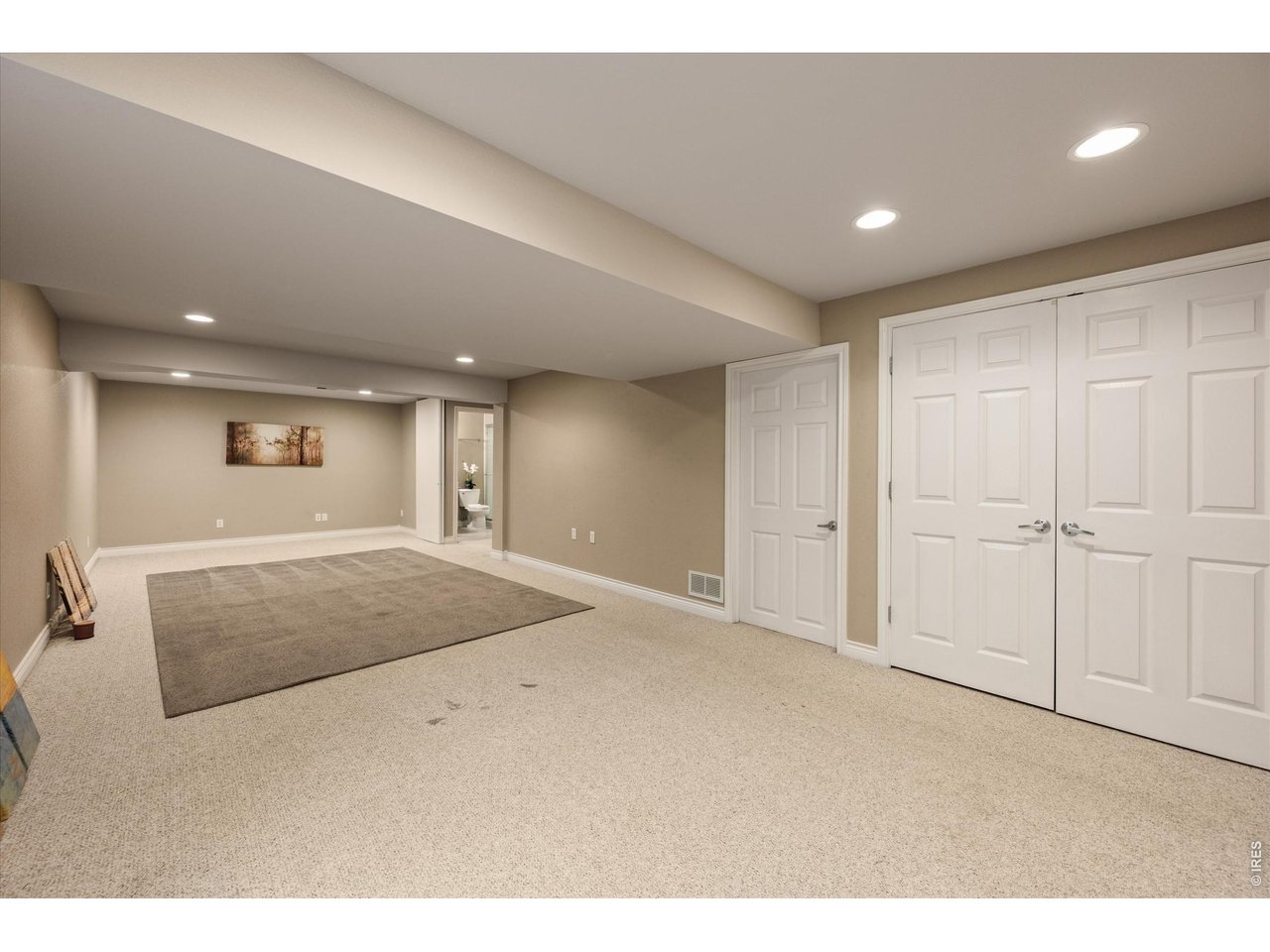Versatile lower-level space - ideal for a 6th bedroom, theater or media room