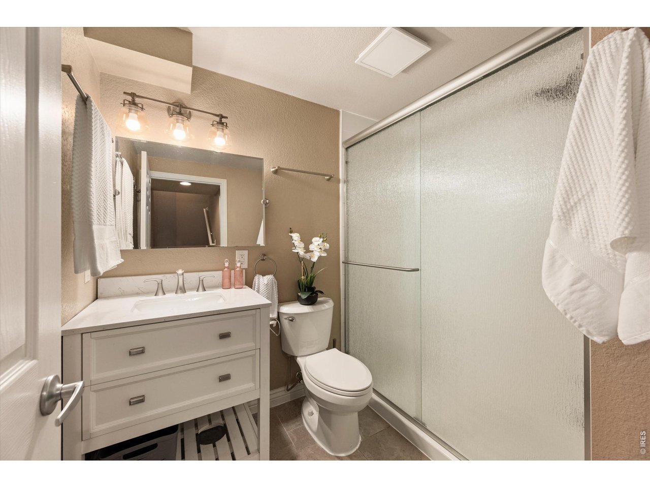 Convenient and modern basement bathroom with clean, functional finishes