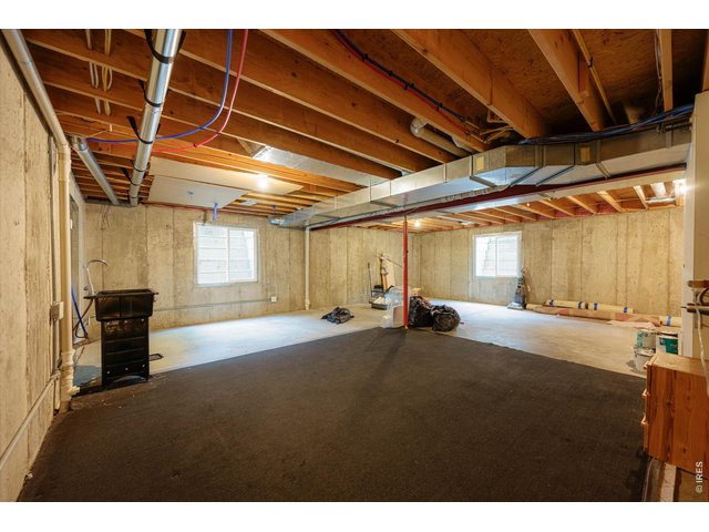 Property Photo 43 Unfinished lower level with utility sink - ideal for gym, storage or future expansion