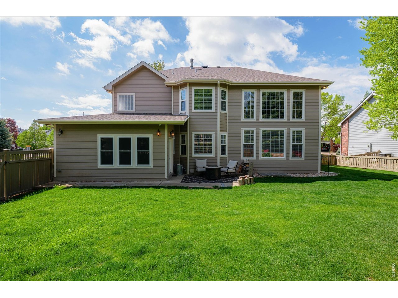 Expansive backyard offering 2 pear trees, 1 plum tree, custom compost area, space, privacy and endless possibilities