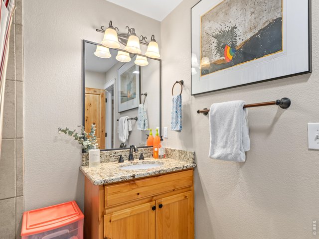 Property Photo 22 Full bathroom across the hall from bedroom two and convenient to living area