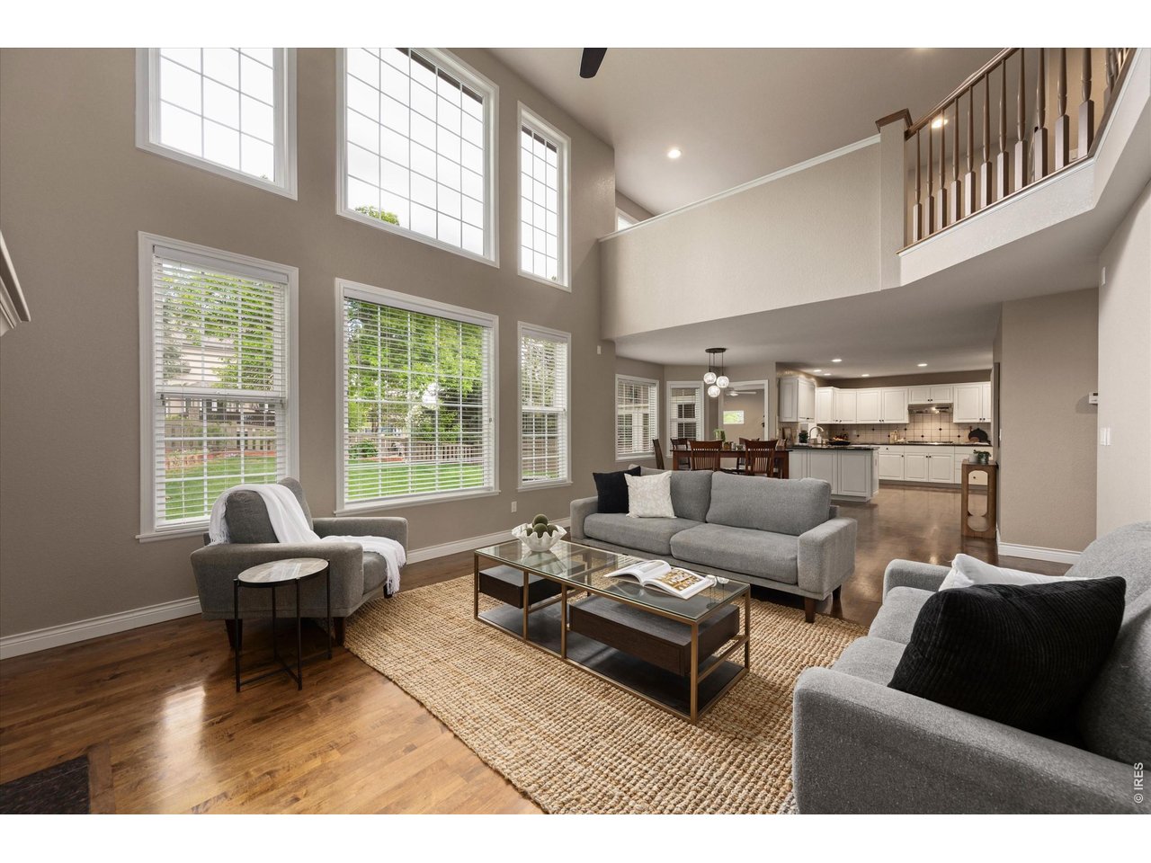 Stunning family room with soaring ceilings and expansive windows 
