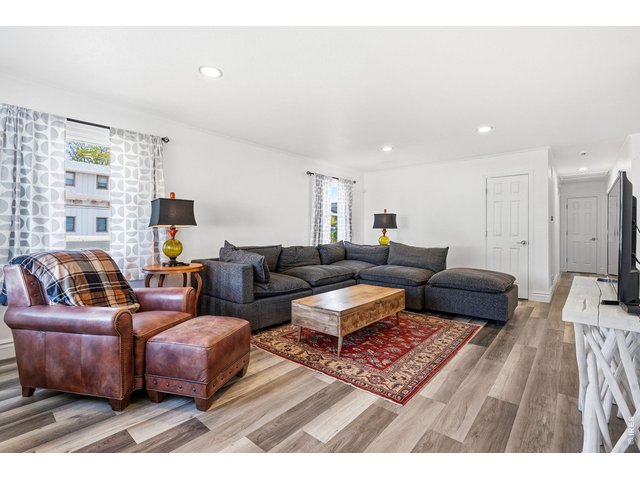 Property Photo 4 Bright and inviting living room with a bay window