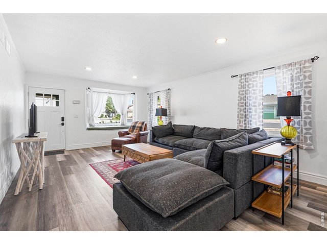 Property Photo 5 Bright and inviting living room with a bay window
