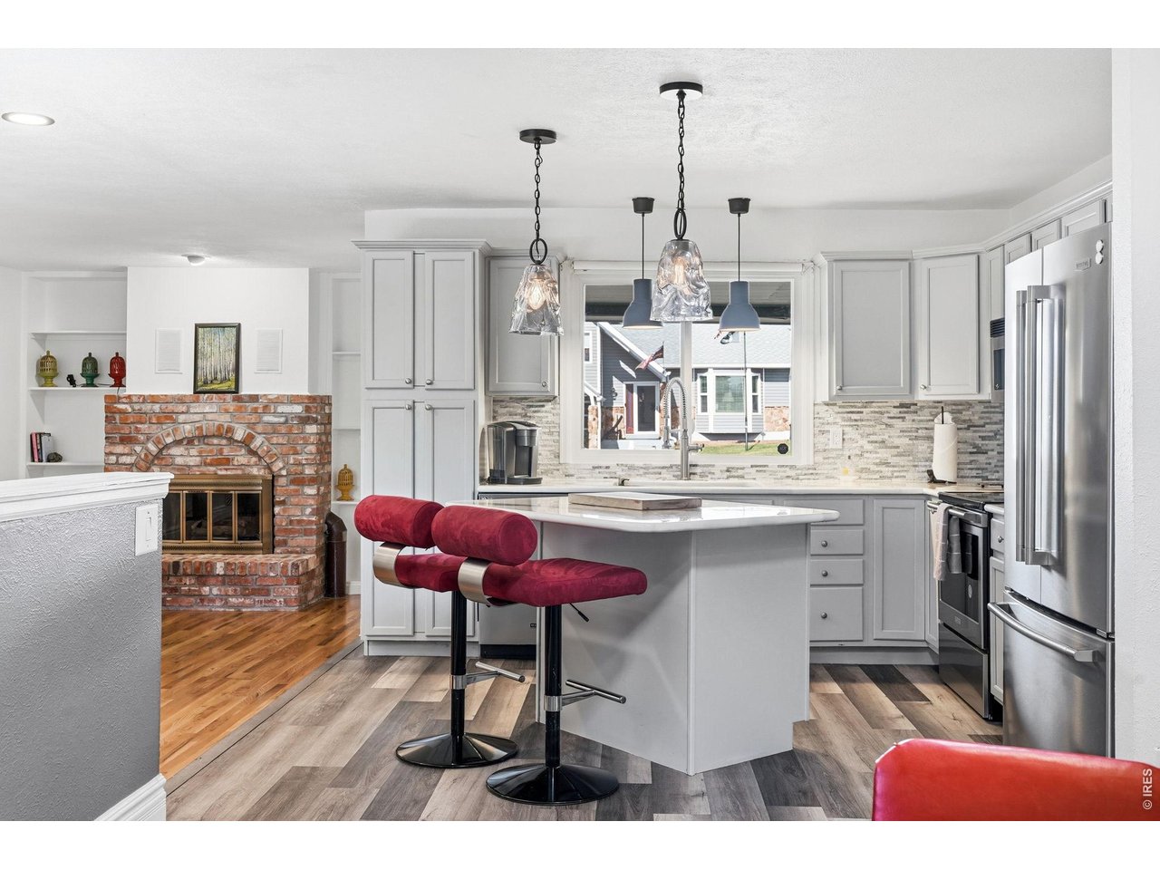 Updated kitchen with all appliances included, new countertops, backsplash, and a center island