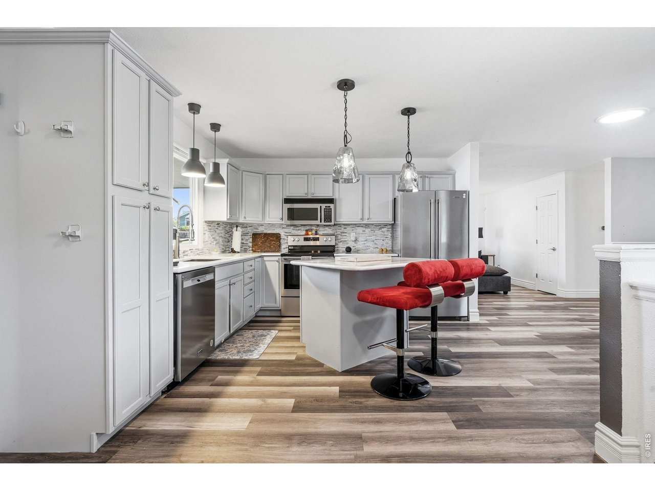 Updated kitchen with all appliances included, new countertops, backsplash, and a center island