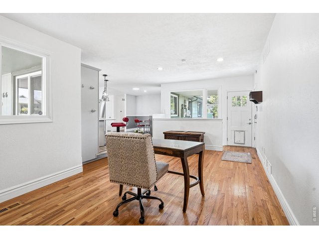 Property Photo 16 Just off the kitchen, the cozy family room offers a brick gas fireplace and built-in bookshelves