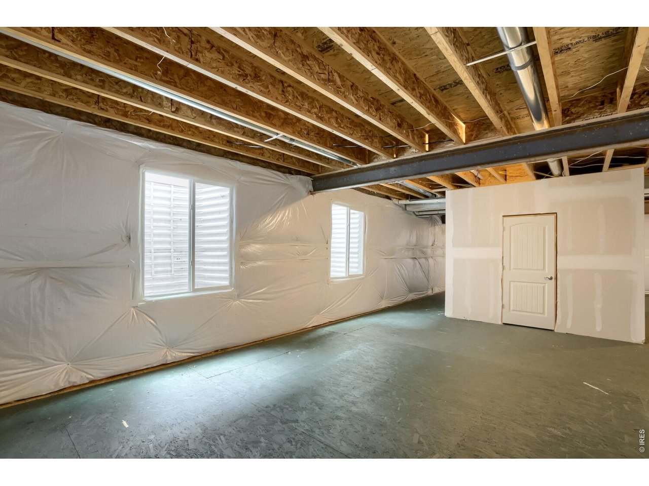 Unfinished basement with structural floor and rough in plumbing
