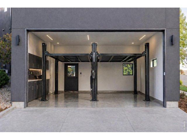 Property Photo 44 Ai rendering of car lift in garage. 