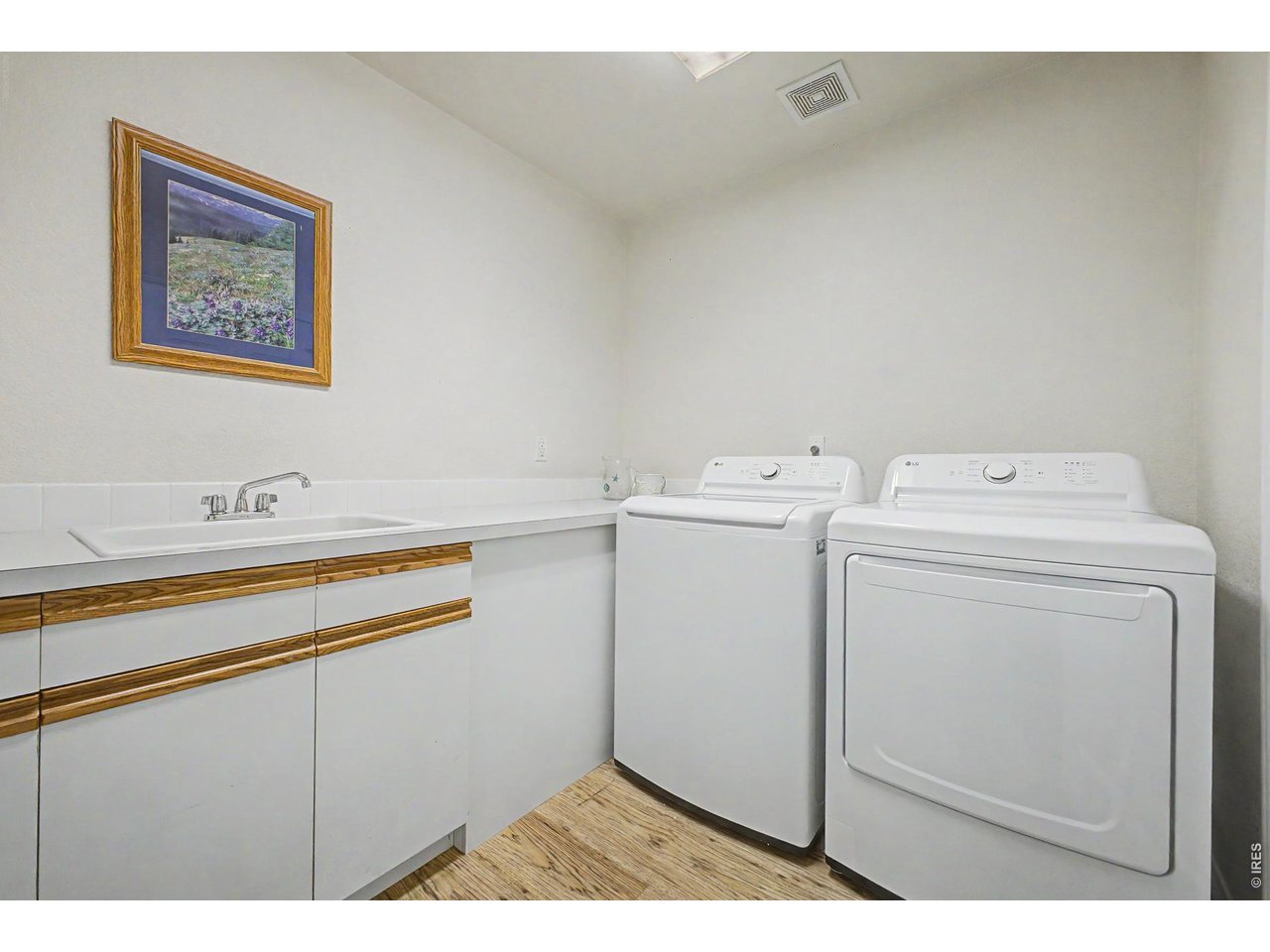 Entryway from Garage w/ laundry, sink and storage 