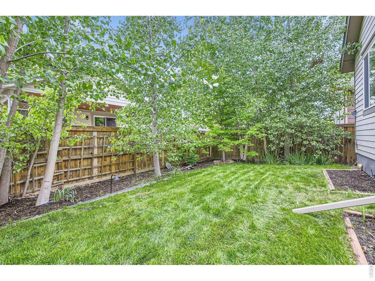 Backyard with lush landscaping