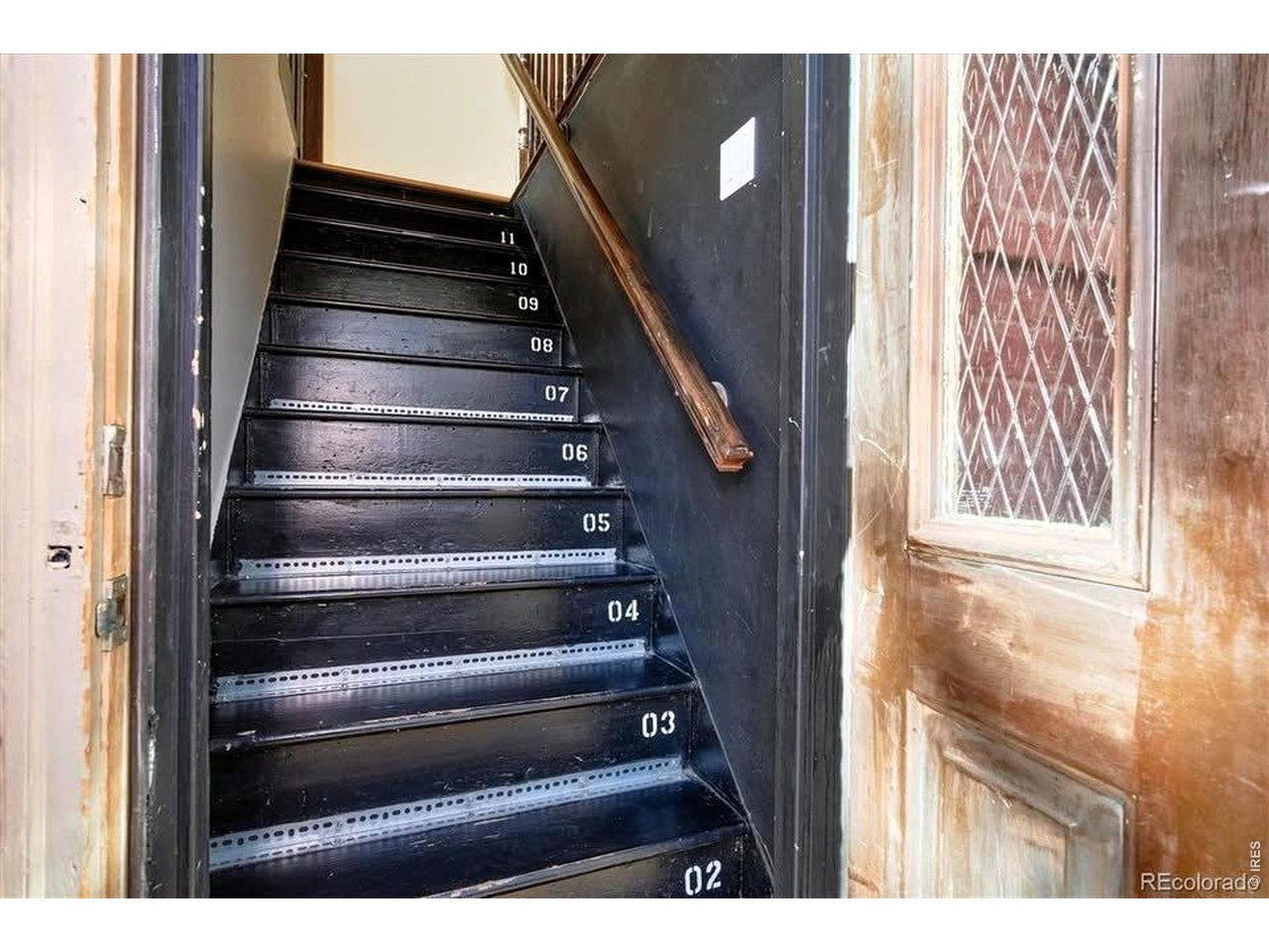 This staircase can access both units to return the property to a single family home, if desired.