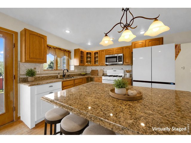 Property Photo 6 Kitchen Virtually Staged " refridgerator pictured does not stay"