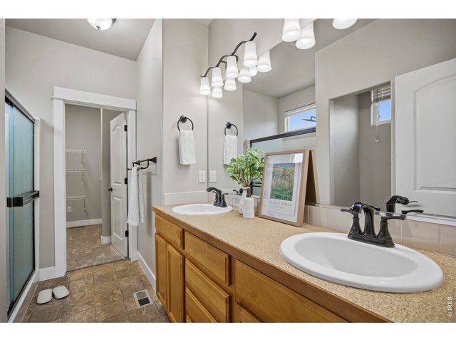 Property Photo 14 Double Sinks, Walk-In Shower and Walk-In Closet with Shelving