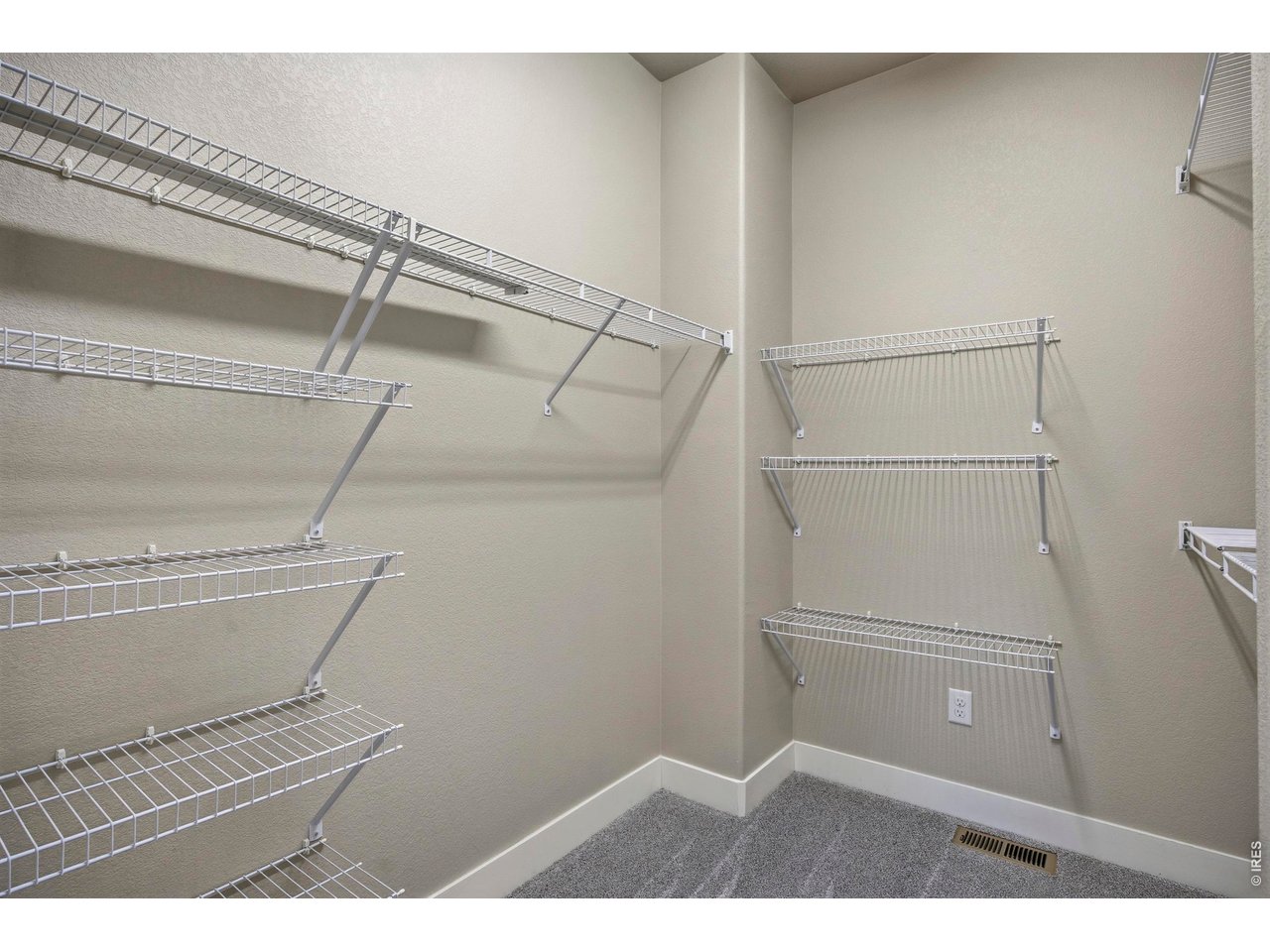 Large Primary Closet with Shelving Racks