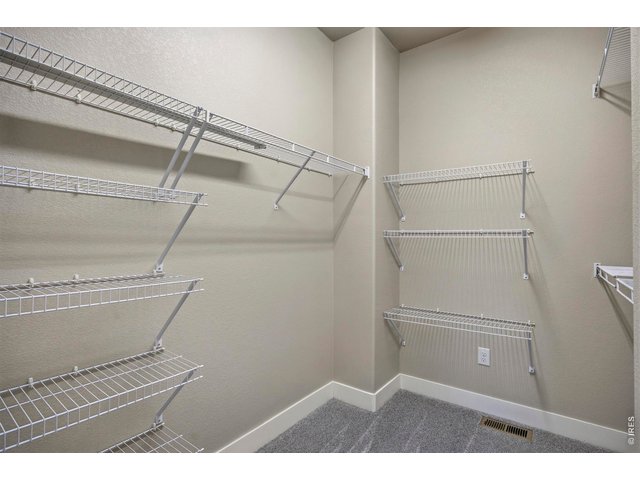 Property Photo 15 Large Primary Closet with Shelving Racks