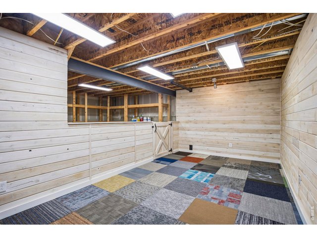 Property Photo 26 Basement Flex Room with adjoining Storage Space
