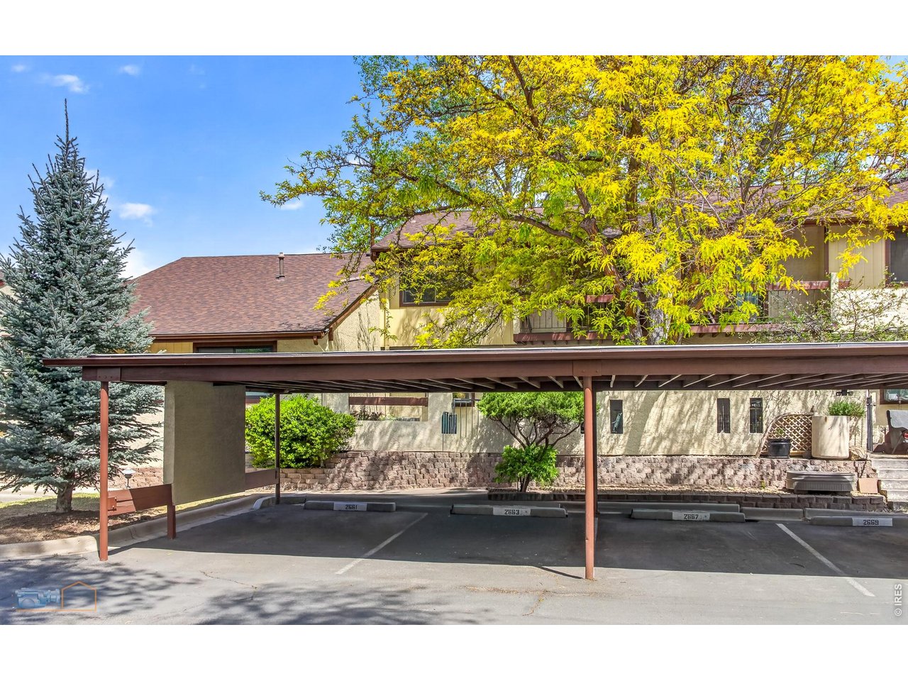 One Covered Assigned Carport to the left of center pole