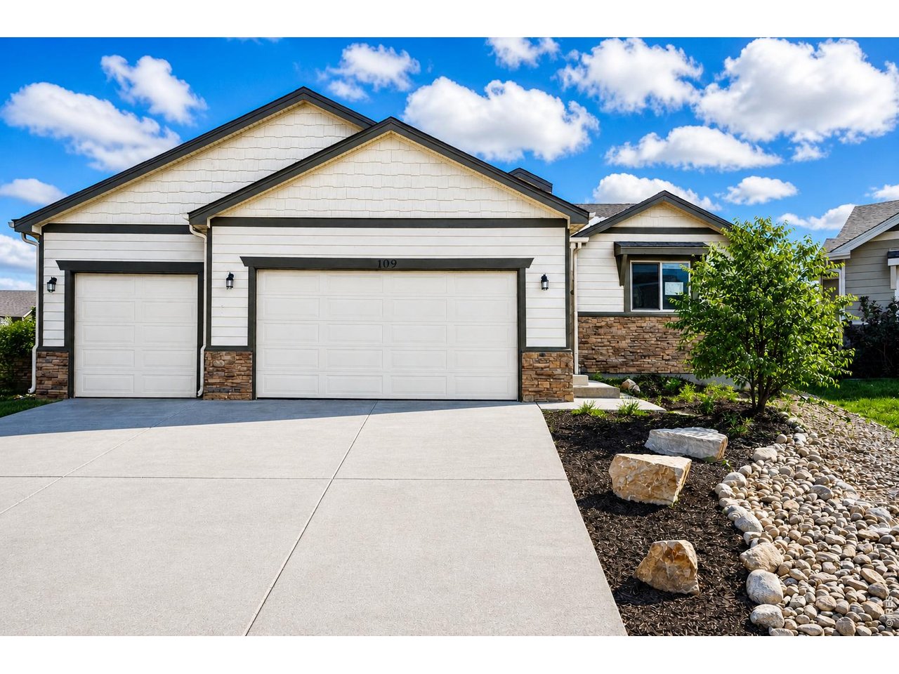 Property Photo 3 Drive up to your huge 3 car garage adjacent to the newly landscaped front yard area