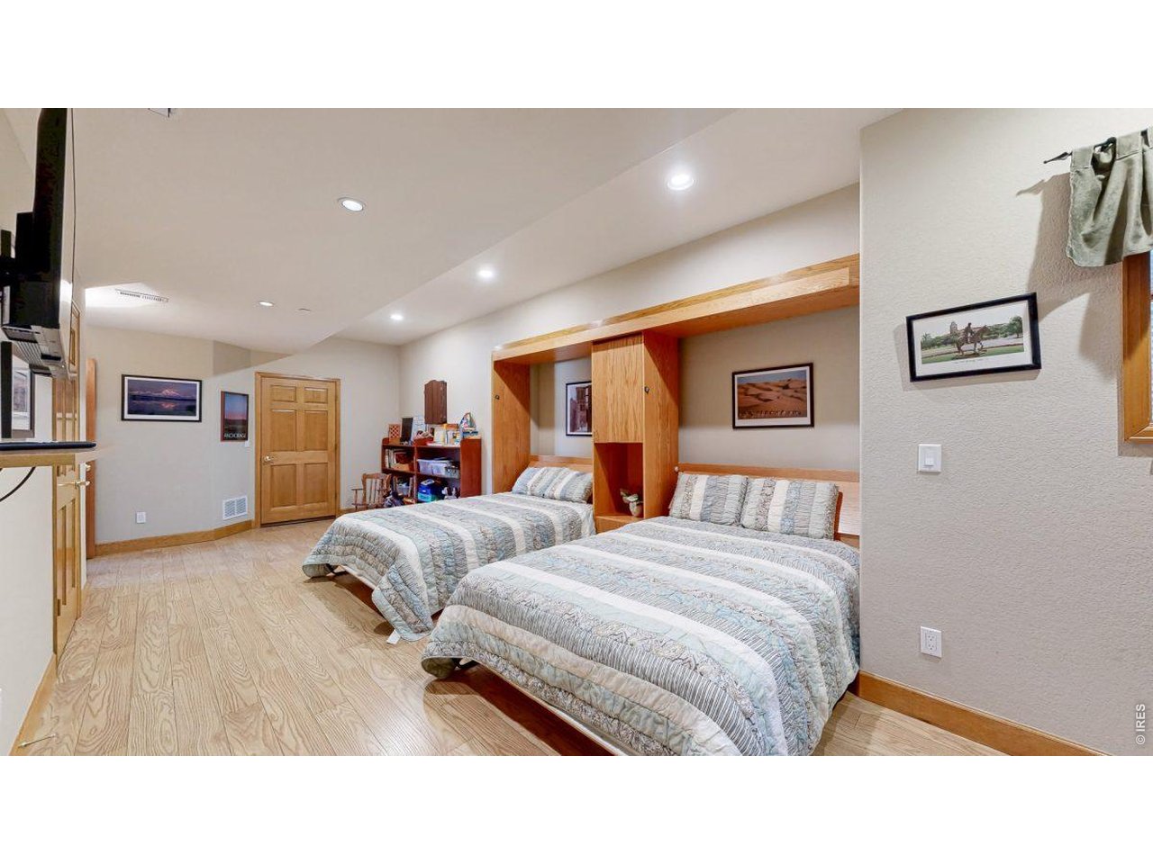 Guest/game room highlighting pull-down queen beds 