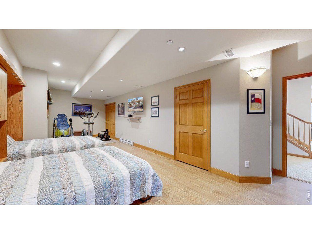 Guest/game room with exercise equipment 