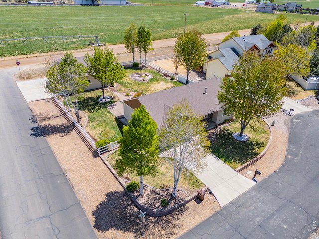 Property Photo 3 Situated on a private corner lot in a quiet cul-de-sac, this property backs to farm ground offering a peaceful, tucked-away feeling while still being conveniently close to town and ample amenities.