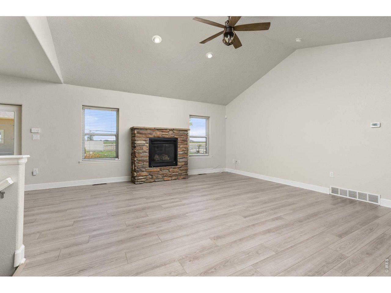 Inside, the ranch-style layout offers an open, vaulted living area with a gas fireplace, fully updated kitchen, and a main-level primary suite. 