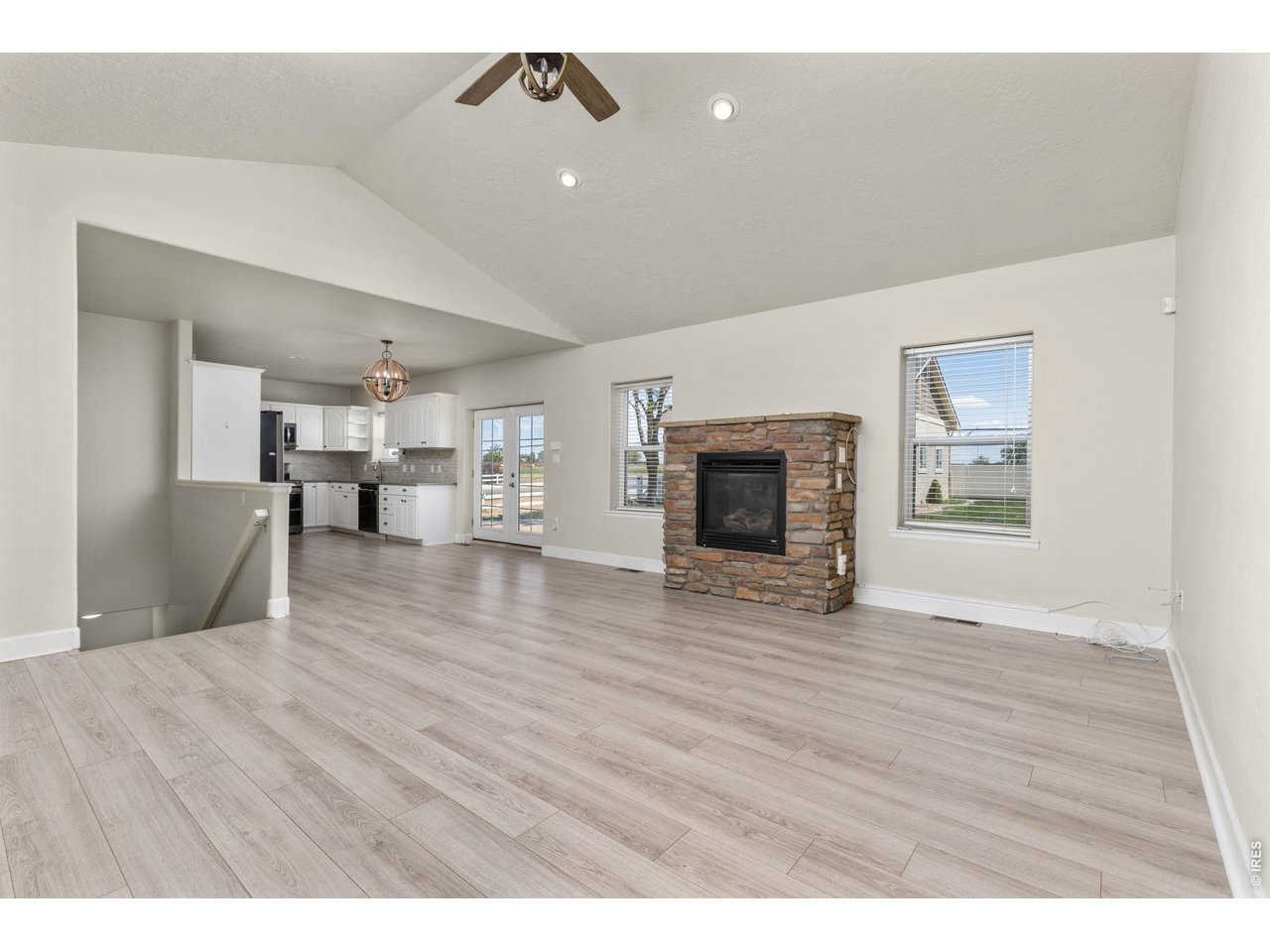 Inside, the ranch-style layout offers an open, vaulted living area with a gas fireplace, fully updated kitchen, and a main-level primary suite. 