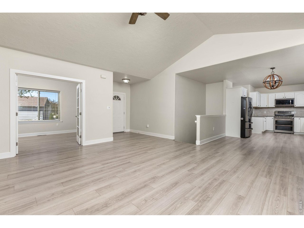 Inside, the ranch-style layout offers an open, vaulted living area with a gas fireplace, fully updated kitchen, and a main-level primary suite. 