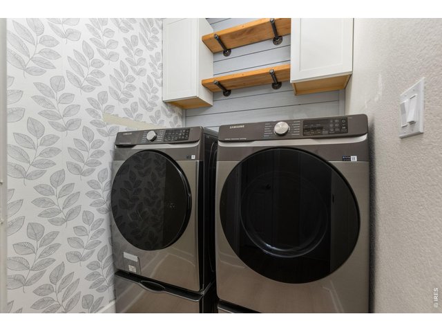 Property Photo 20 Laundry room with built in storage and custom shelving