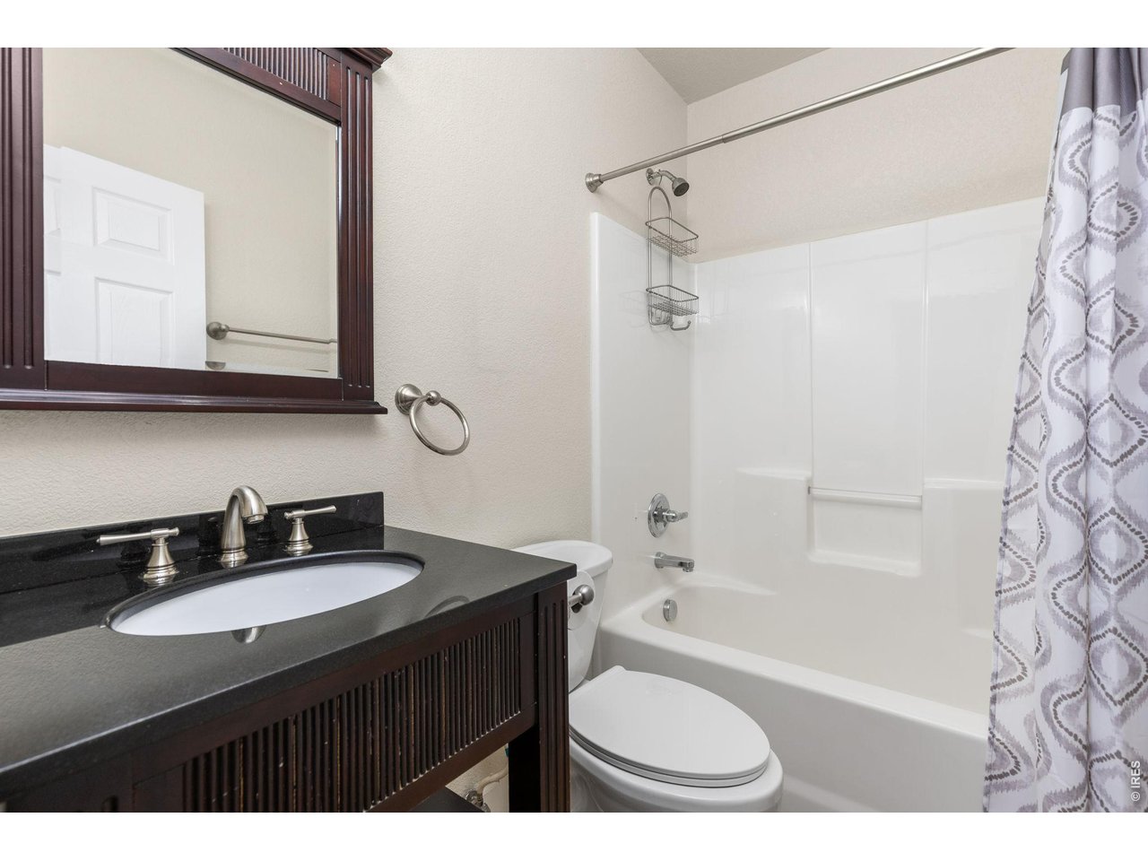 Main level full bathroom with updated vanity & lighting!