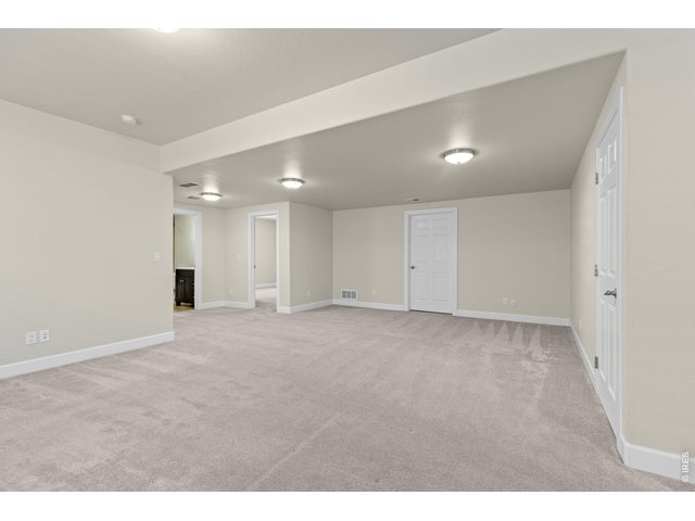 Property Photo 28 Another standout feature of the home is the fully finished basement featuring a large rec room that gives you flexibility for entertaining or relaxing.