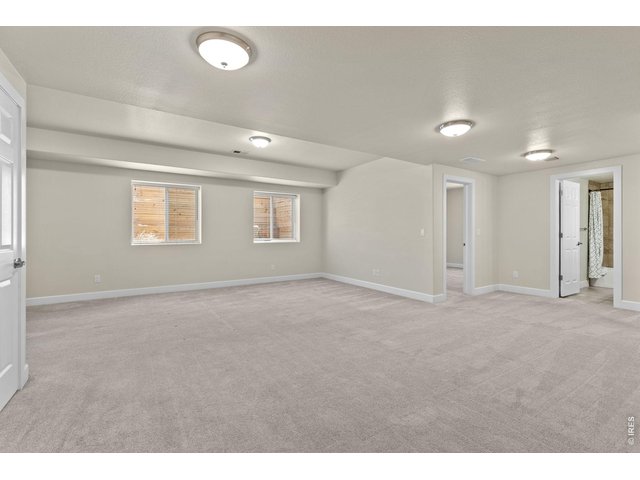 Property Photo 29 Another standout feature of the home is the fully finished basement featuring a large rec room that gives you flexibility for entertaining or relaxing.