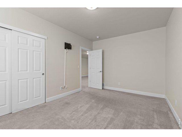 Property Photo 33 Bedroom #4. The basement also features two bedrooms and an updated full bathroom.