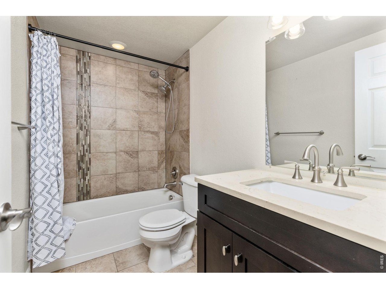 The basement also features two bedrooms and an updated full bathroom. Bathroom features tile shower, tile flooring, updated vanity & lighting!